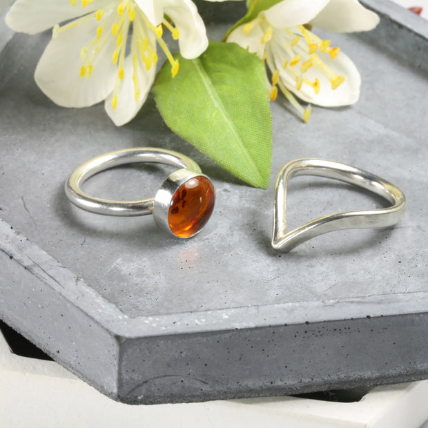 Eco silver round ring band with an Amber gemstone. It&