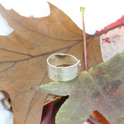 Eco silver leaf adjustable ring. A ring band in a long leaf shape with a real leaf texture. Both ends are folded over each other and are adjustable by pushing or pulling on the ring slightly.