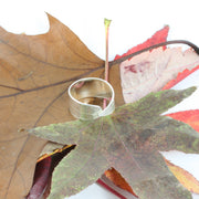 Eco silver leaf adjustable ring. A ring band in a long leaf shape with a real leaf texture. Both ends are folded over each other and are adjustable by pushing or pulling on the ring slightly.