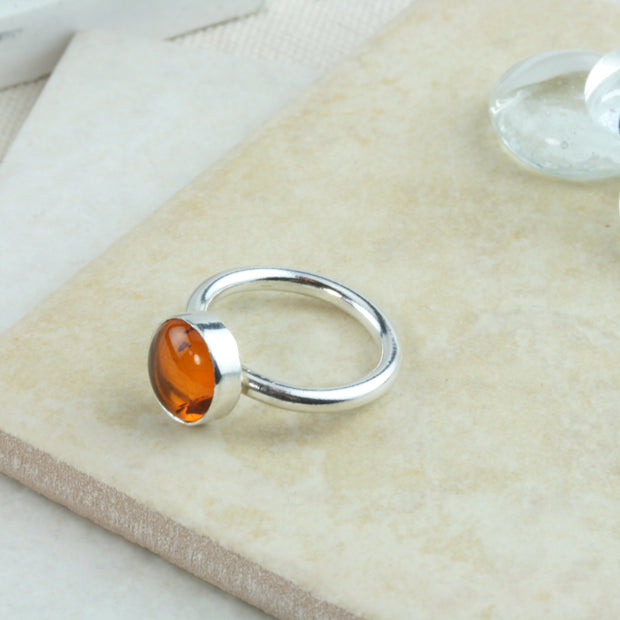 Eco silver round ring band with an Amber gemstone. It&