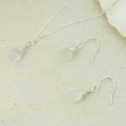 Silver briolette pendant necklace featuring a White Moonstone faceted teardrop gemstone. The facets point at different angles catching the light perfectly for a bit shimmer and shine. It is wrapped with eco silver wire and dangles from a delicate silver necklace. Paired here with matching Silver briolette earrings.