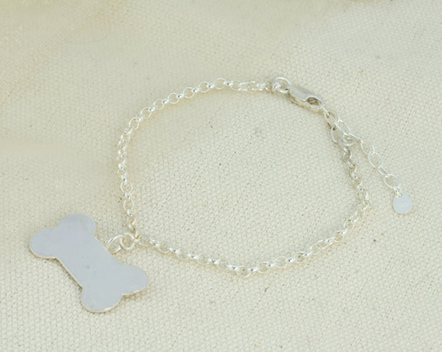 Silver personalised dog bone charm bracelet The dog bone is approximately 2.5 x 1.3cm in size and can be personalised with a word, initials, letter or symbols. This charm is also available as a pendant necklace. The briolette gemstones is attached to the same jump ring as the pendant, so they sit together. The necklace can be fastened at three different lengths at 40cm, 45cm and 50cm.