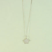 Silver pendant necklace featuring a small star with slightly curved sides and slightly rounded points. It has a matte finish.