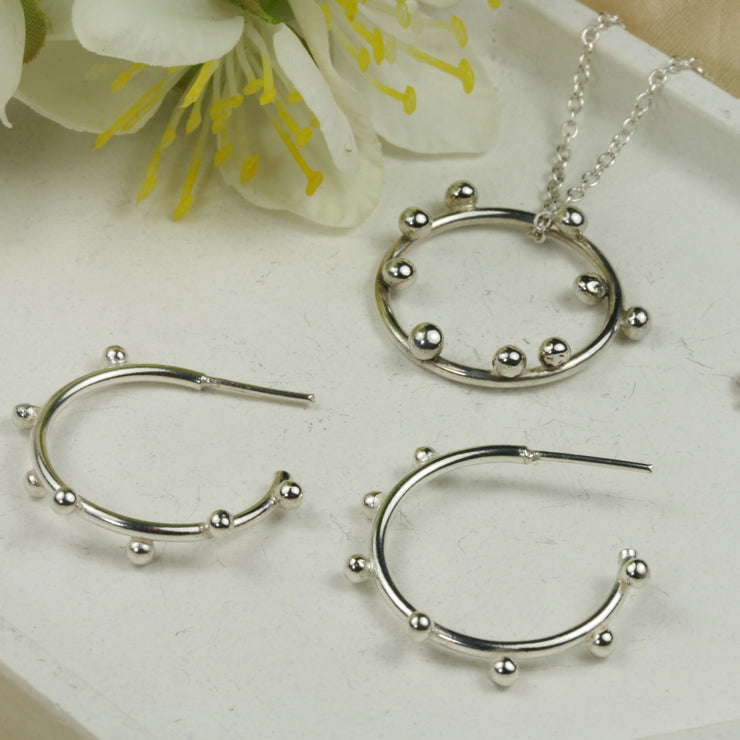 Set of a silver hoop pendant and hoop earrings. Featuring silver bubbles, All handmade using eco-silver. 