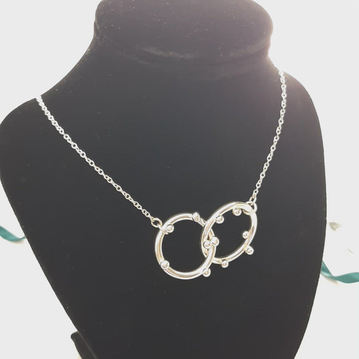 Silver hoop necklace with two hoops and silver balls