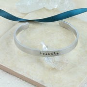 Personalised aluminium bangle bracelet.