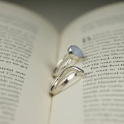 Eco silver wishbone ring and classic gemstone ring with a Blue Lace Agate gemstone. This ring is made using D shaped wire with the curve on the inside and the flat side on the outside. The rich dips into a V-shape on one side. This  design is beautiful on its own and in combination with a gemstone ring allowing space to wrap around it.