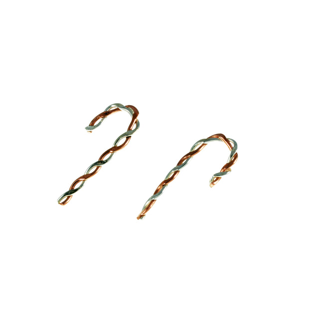 Silver and copper stud earrings. Silver and copper wire has been twisted around each other and shaped into a candy cane shape. Available in two sizes and a matching pendant necklace is also available.