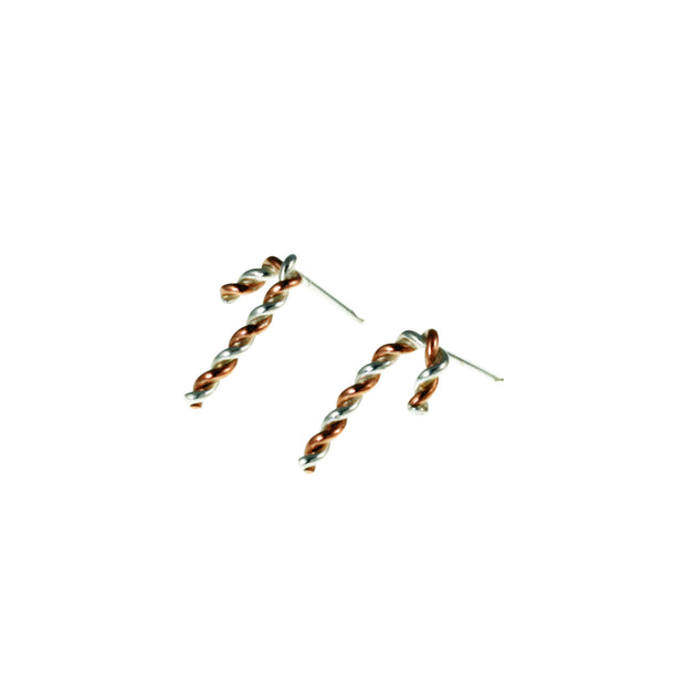 Silver and copper stud earrings. Silver and copper wire has been twisted around each other and shaped into a candy cane shape. Available in two sizes and a matching pendant necklace is also available.