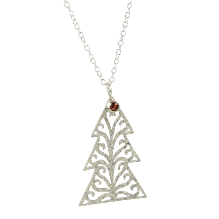 Silver pendant necklace in the shape of a Christmas three with three layers. The tree features a hand drawn pattern which is hand sawn with swirls from the centre to the sides. It has a hammered texture which has been polished to a shiny finish, giving it a shimmer effect.