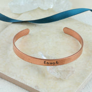 Personalised copper bangle bracelet.