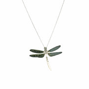Pendant necklace featuring a pendant in the shape of a dragonfly. It has been given a hammered texture with the wings given an oxidised darker finish.