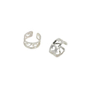 Eco silver ear cuffs featuring 5 half heart shaped swirls. The half hearts sit inside an open band and are lined up one after the other in a perfect line. They have a hammered shiny finish.