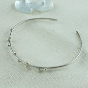 Eco silver bangle bracelet featuring ten silver balls.  The bangle is 65mm wide and can be adjusted to fit and put on and take off.