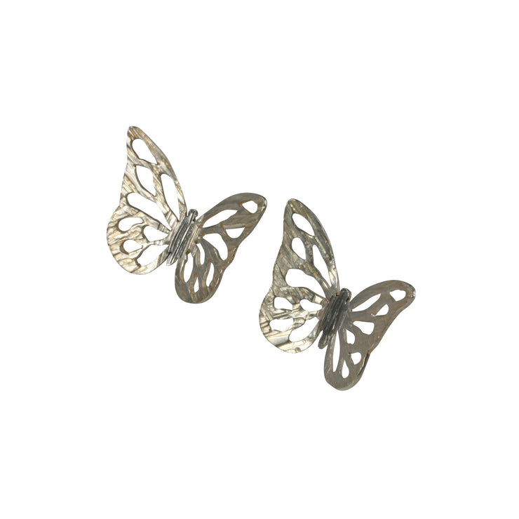 Eco silver butterfly stud earrings. The pattern is sawn out by hand and the striped texture and shiny finish give these butterflies a shimmering finish. The body has a darker oxidised finish.
