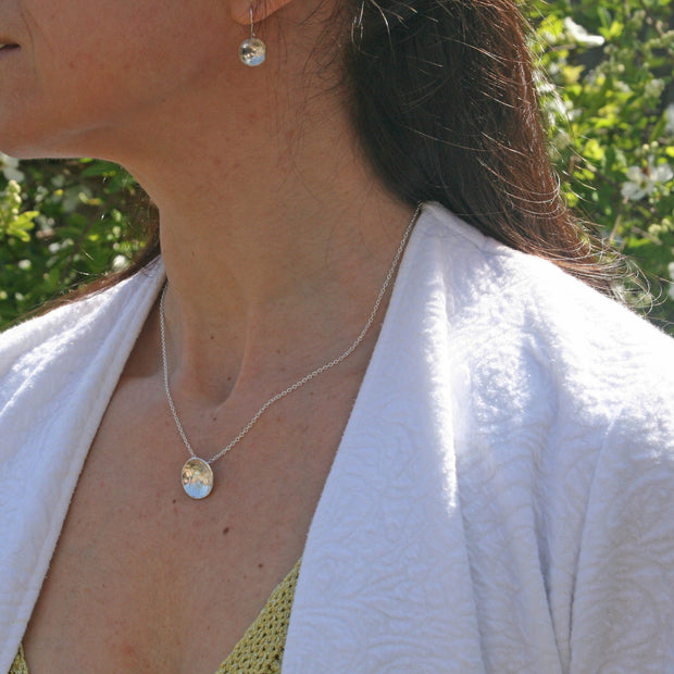 Eco silver pendant necklace and drop necklace with a pebble texture and mirror finish.