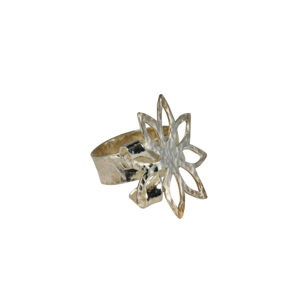 Silver wider ring band that is open on one end and holding the flower in place on the other end. The flower has sharp pointed leaves and the flower and band have a round hammered texture and mirror finish.