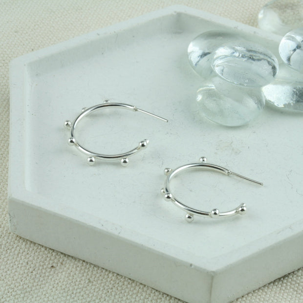 Eco silver hoop stud earrings featuring 7 silver balls. Available in three sizes these are the medium size at 13mm / 0.8" in diameter. These are handmade hoops made form eco-silver. 