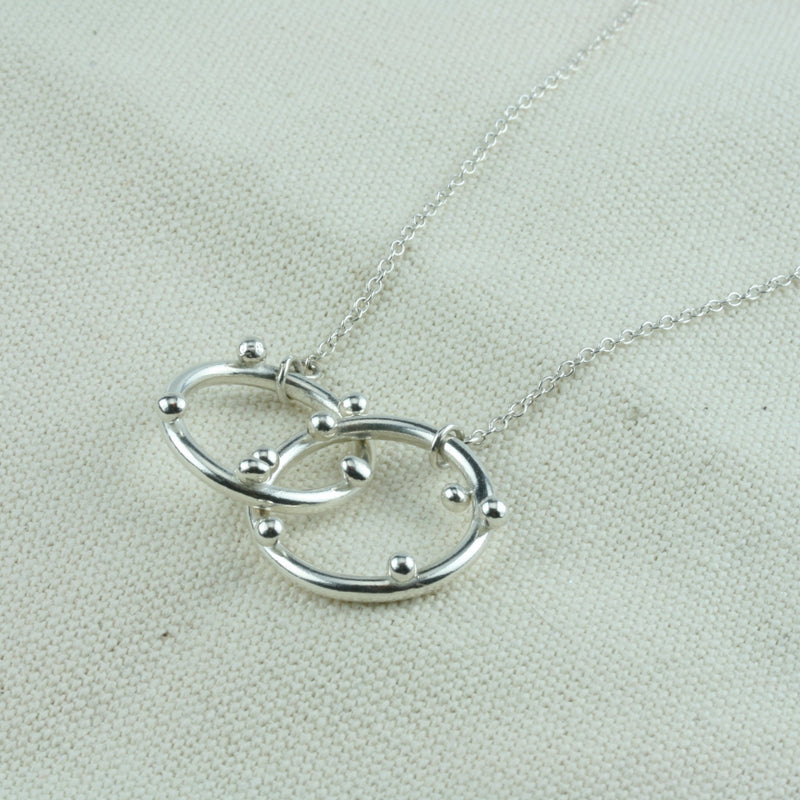 Silver hoop necklace with two hoops and silver balls