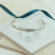 Silver personalised bangle. This bangle bracelet features a Tree of life stamp and three hearts with 'New beginnings' in between them. Of course any text with available symbols can be added to the bangle, on the outside or inside for an extra special touch.