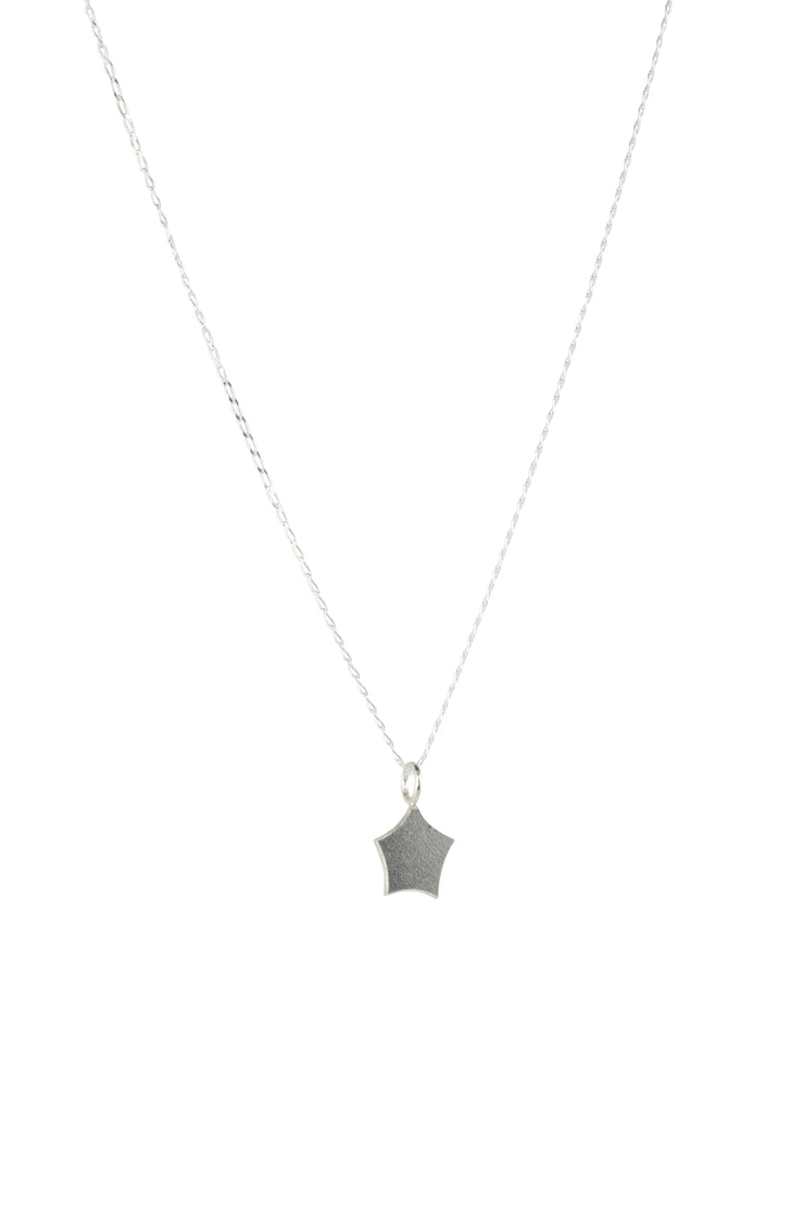 Silver pendant necklace featuring a small star with slightly curved sides and slightly rounded points. It has a matte finish.