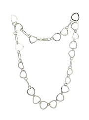 A silver necklace featuring silver triangle shaped links connected by small jump rings. The triangles have a hammered texture which lets the light bounce of f in all directions making it shimmer and sparkle. It's fastened with a lobster clasp.