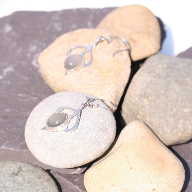 Silver hook earrings with a leaves and flower bud shape. The flower bud features a Grey Moonstone gemstone.