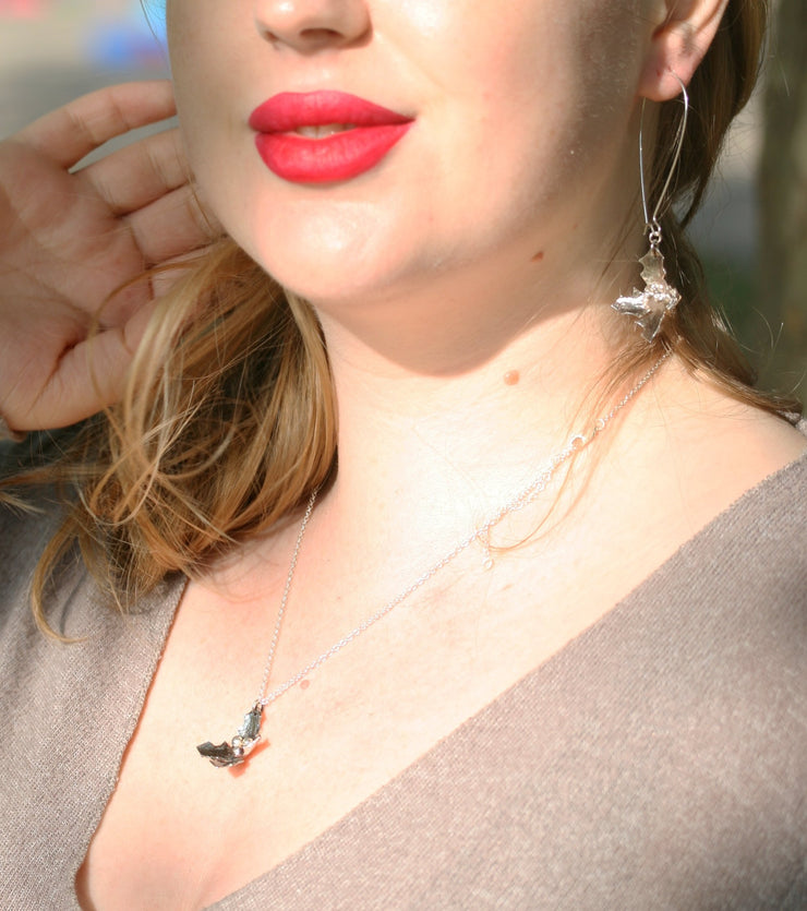 Set of the Silver holly pendant necklace and Silver holly drop earrings. All featuring holly with four leaves with a hammered texture and aged darker finish, polished to a shine. And three shiny silver berries in the centre.