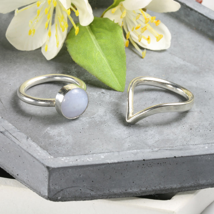 Eco silver wishbone ring and Blue Lace Agate gemstone ring. This ring is made using D shaped wire with the curve on the inside and the flat side on the outside. The rich dips into a V-shape on one side. This  design is beautiful on its own and in combination with a gemstone ring allowing space to wrap around it.