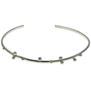 Eco silver bangle bracelet featuring ten silver balls.  The bangle is 65mm wide and can be adjusted to fit and put on and take off.