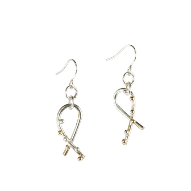 Silver hook earrings featuring a twirl shape. Three 9ct gold and three silver balls are featured to one side at the front of the earrings. They have a shiny mirror finish.