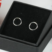 Small silver hoop stud earrings, approximately 6mm in diameter. They have a shiny silver finish and are made from eco silver.