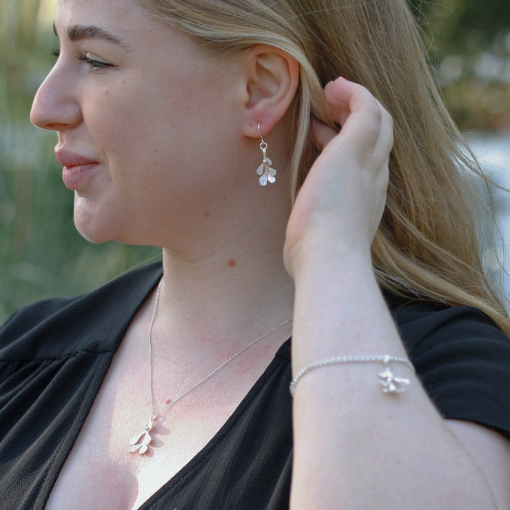 Set of Mistletoe jewellery, featuring the silver Mistletoe chain bracelet, Silver Mistletoe hook earrings and Silver Mistletoe pendant necklace.