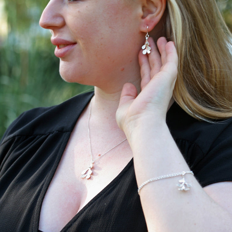 Set of Mistletoe jewellery, featuring the silver Mistletoe chain bracelet, Silver Mistletoe hook earrings and Silver Mistletoe pendant necklace.