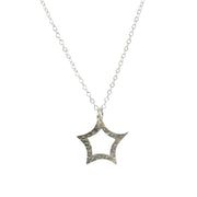 A silver necklace adjustable to two lengths featuring a star pendant. The star is open in the middle and it's sides are curved rather than straight, giving it a fun look. The front has a hammered texture and shiny finish while the back has a mirror finish.