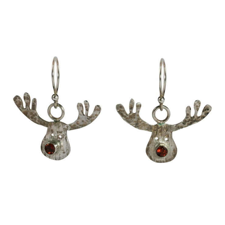 Silver hook earrings featuring a sawn out Rudolph head. The face has a striped texture and shiny silver finish. The Antlers have a round hammered texture and are aged to give them a darker look, they have been polished to a shine. The red nose is a Garnet gemstone set in a tube setting. A matching pendant necklace and ring are available as well. 