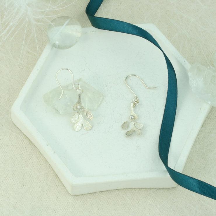 Silver hook earrings featuring Mistletoe with a silver ball as a berry. The leaves have a striped texture and a shiny silver finish. The total drop is 2.5cm from the hook.