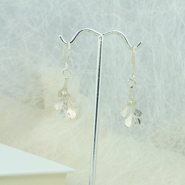 Silver hook earrings featuring Mistletoe with a silver ball as a berry. The leaves have a striped texture and a shiny silver finish. The total drop is 2.5cm from the hook.