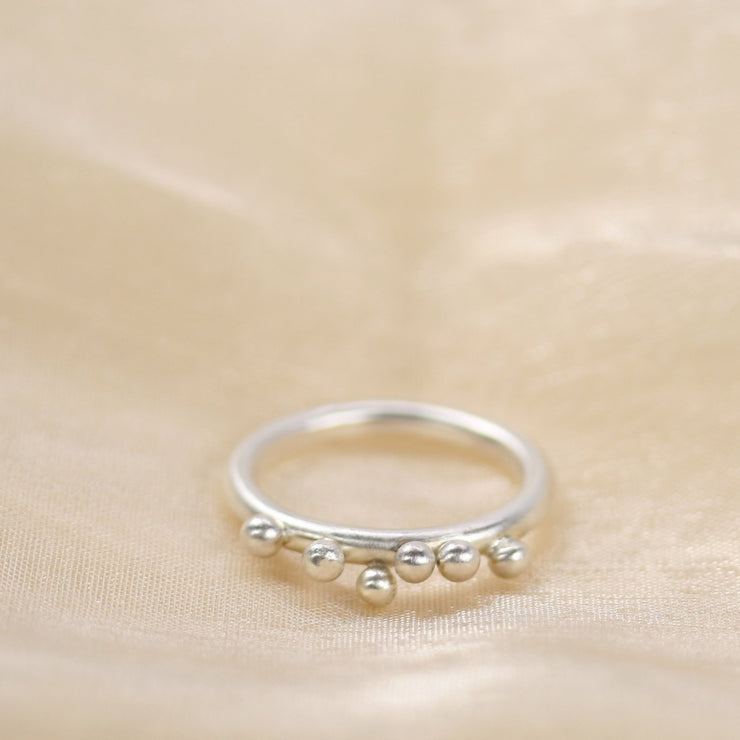 Eco silver round ring with 6 silver balls. It has a matte finish and made from 2.5mm /  0.1" round eco silver wire