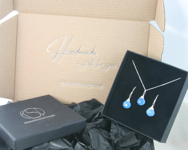 Silver briolette set with a pendant necklace and earrings with Blue Chalcedony faceted heart gemstone.