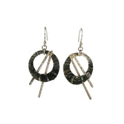 Silver hook earrings featuring open circles that have three folds from top to bottom and a round hammered texture. They have a darker oxidised finish. The two bars have a hammered texture and shiny silver finish.