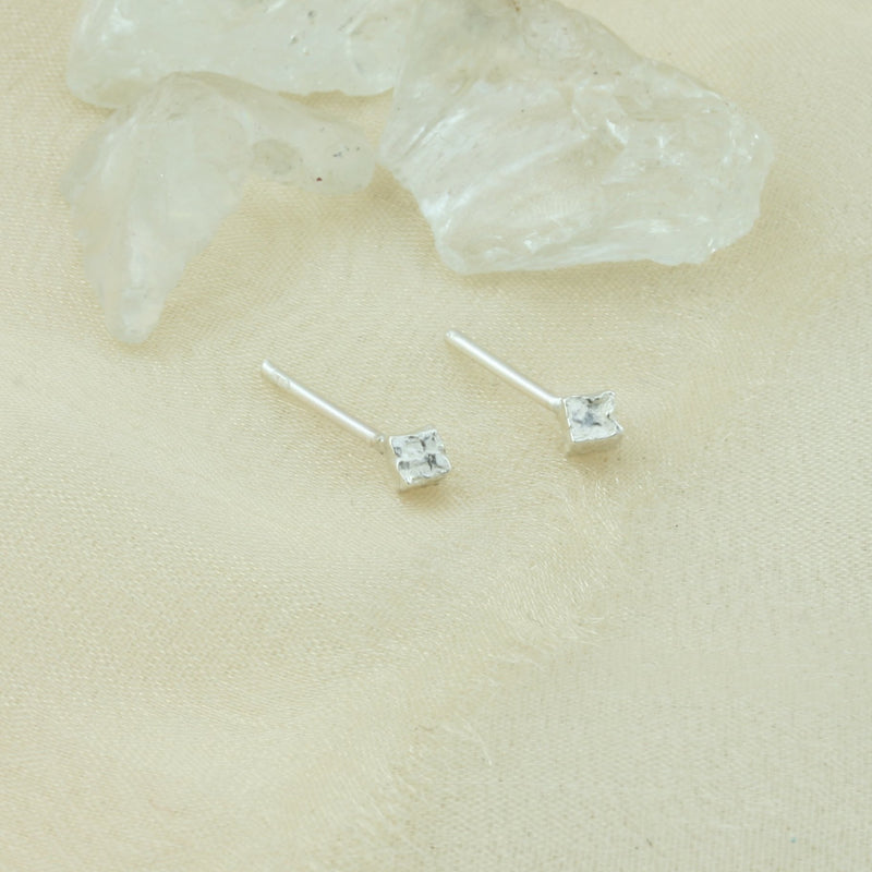 Silver cube stud earrings, featuring a hammered and shiny finish to make them sparkle. Made using eco silver.