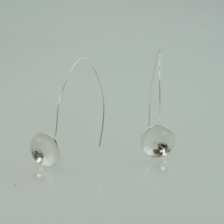 Eco silver drop cup earrings. The drop hook and cup are made from eco silver. The cup has been given a pebble texture and a mirror finish.