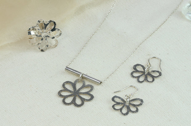 Set of silver flower with round leaves jewellery with the adjustable statement ring, pendant necklace and hook earrings.