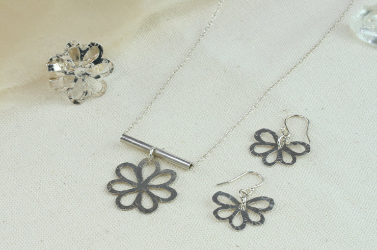 Set of silver flower with round leaves jewellery with the adjustable statement ring, pendant necklace and hook earrings.
