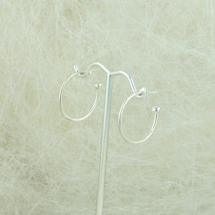 Silver hoop earrings with briolette gemstones. Classic hoop earrings, featuring a shiny polished finish..