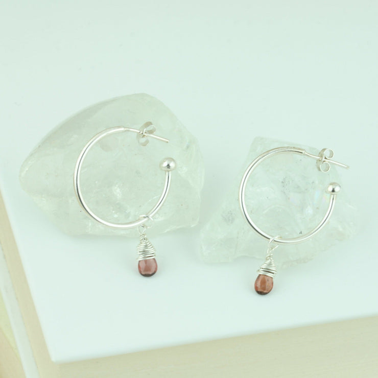 Silver hoop earrings with briolette gemstones. Classic hoop earrings, featuring a shiny polished finish. Shown here on combined with the Garnet briolette gemstones.  Separate gemstones to add to your collection are available as well.