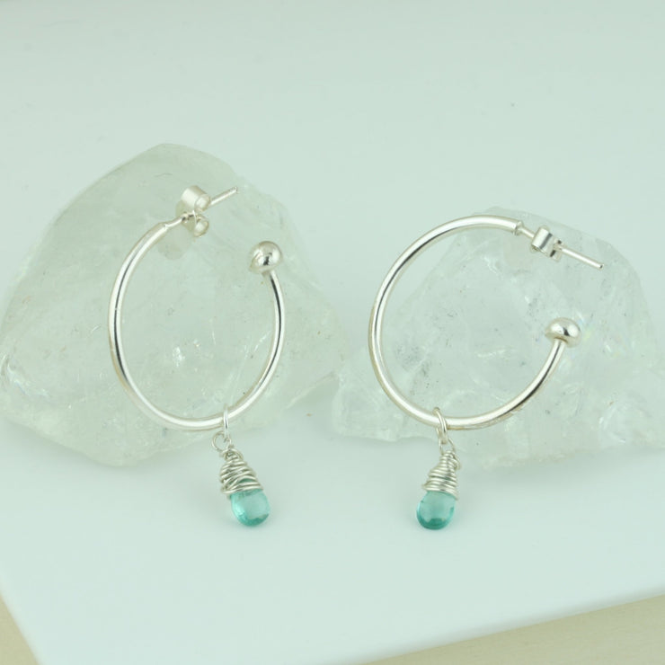 Silver hoop earrings with briolette gemstones. Classic hoop earrings, featuring a shiny polished finish. Shown here on combined with the Ocean Apatite briolette gemstones.  Separate gemstones to add to your collection are available as well.