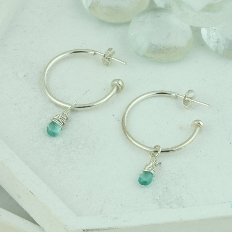 Silver hoop earrings with briolette gemstones. Classic hoop earrings, featuring a shiny polished finish. Shown here on combined with the Ocean Apatite briolette gemstones.  Separate gemstones to add to your collection are available as well.
