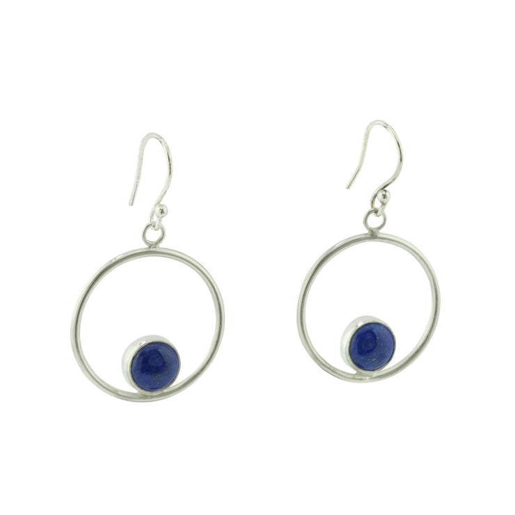 Silver hoop hook earrings featuring a Lapis Lazul gemstone. The gemstone is 8mm in diameter and is set in a cabochon setting at the bottom on the inside of the hoop. These are handmade earrings, made form eco-silver.